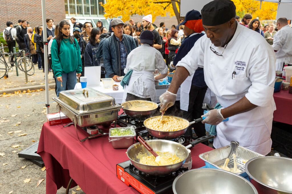 Mac N Cheese Smackdown  - Chefs serving to students and staff