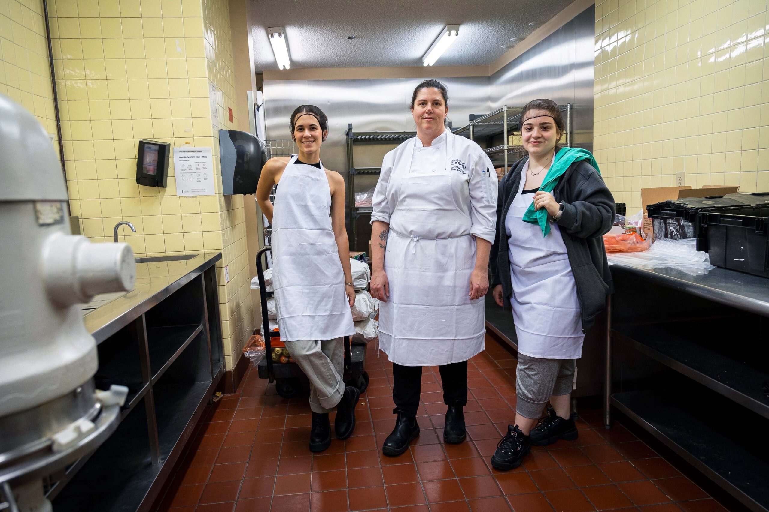 Chef Trish and students prepare meals for the holidays in the kitchen at Chestnut Residence at U of T